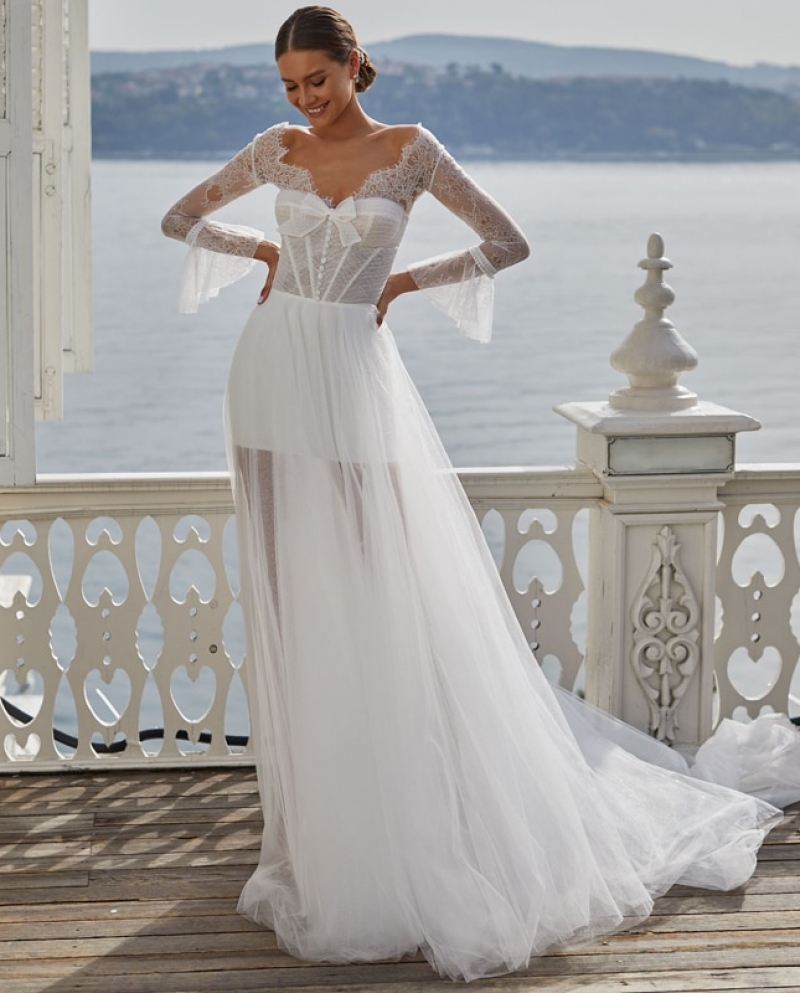 https://d3thqe68ymbqps.cloudfront.net/1868292-large_default/boho-white-lace-wedding-dress-graceful-beach-see-through--a-line-brida.jpg