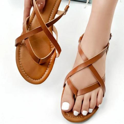 sandalias de mujer נשים נעל 2023קיץ חדש סנדלי הידוק רצועת חוף חלולה נעל חוף נעל רומית נוחות חול שטוח